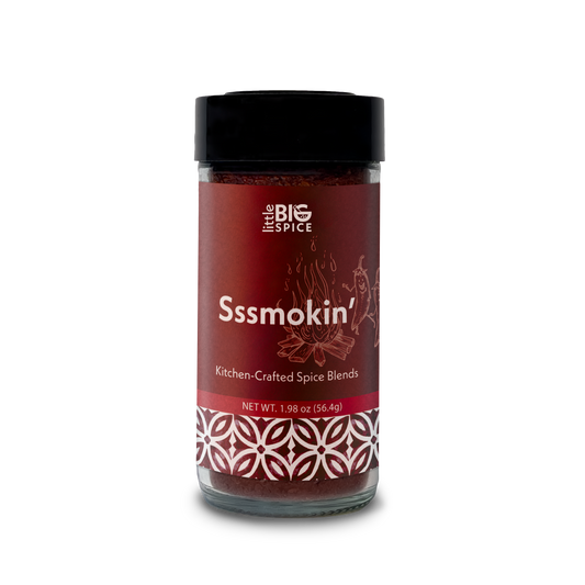 Spice bottle with colored label for “Sssmokin’” bold and spicy smoky Mediterranean seasoning.